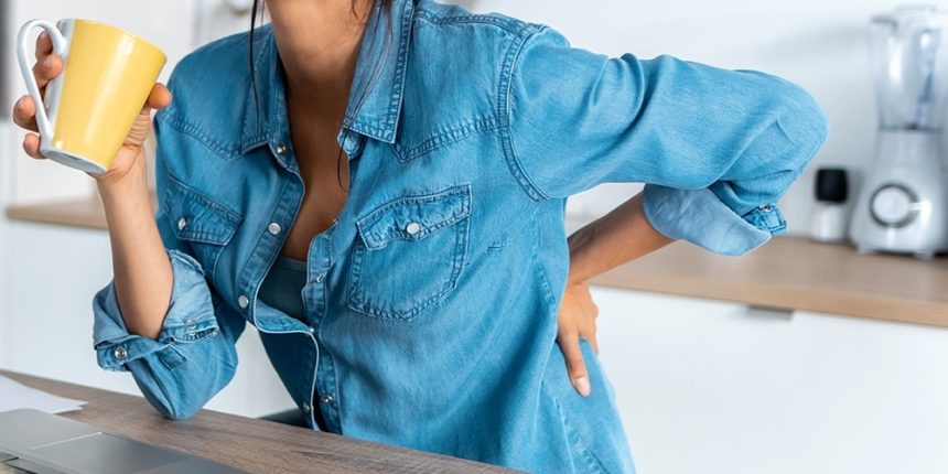 woman back pain at work