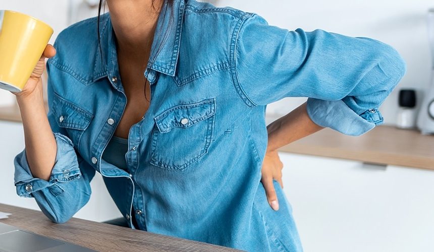 Understanding Back Pain woman back pain at work