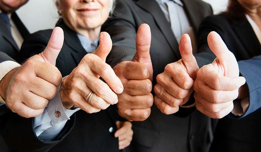 Staying healthy at any age business people giving thumbs up
