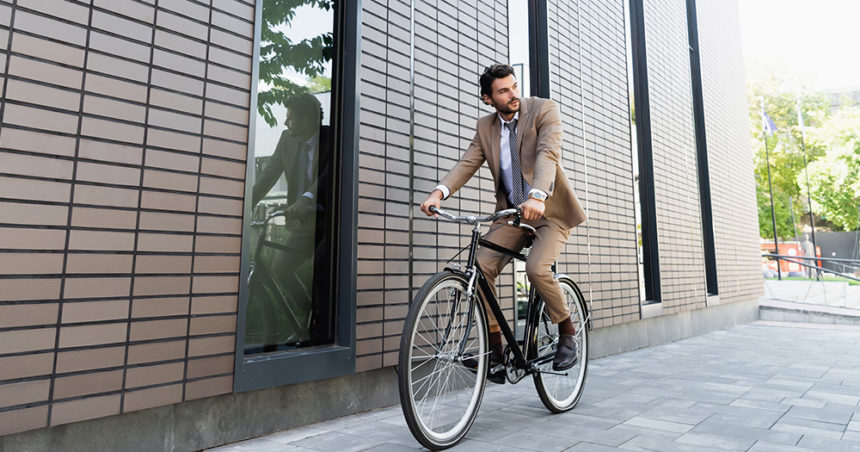businessman riding a bicycle