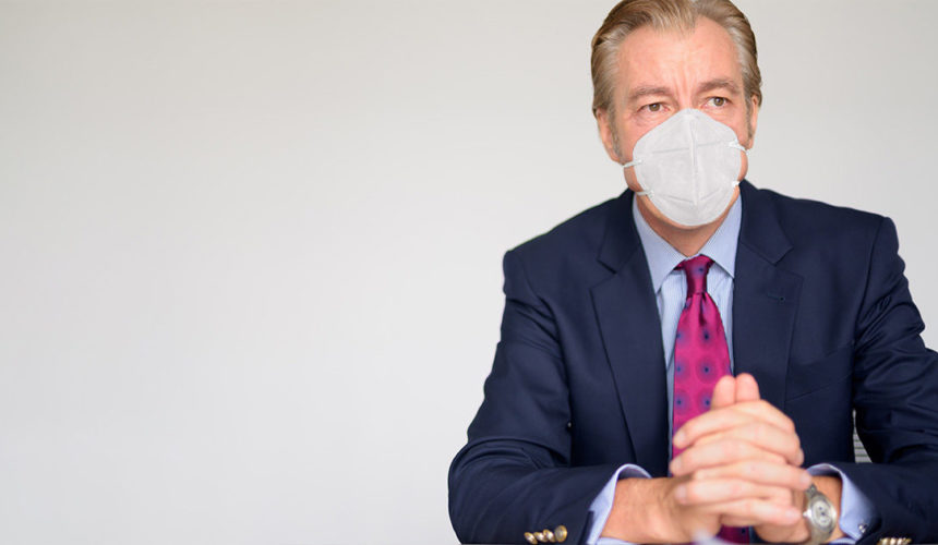 Covid-19 assessment – Decontainment management in companies businessman with ffp2 mask