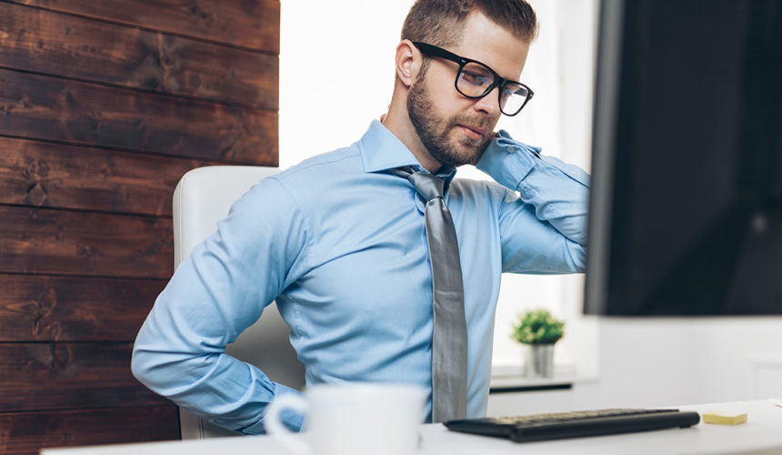 Back pain man with back pain at the office