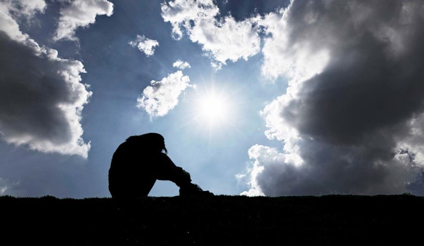 Mental Health First Aid Training depressed person dark sky