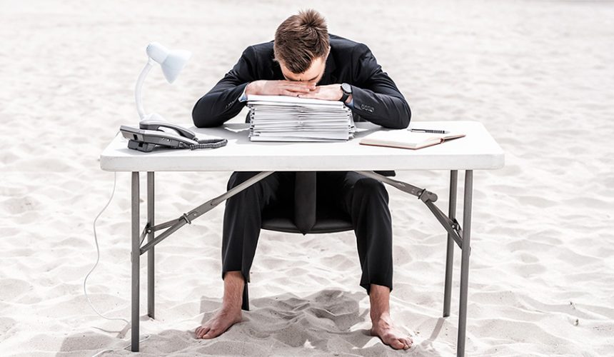 man tired from work on holiday