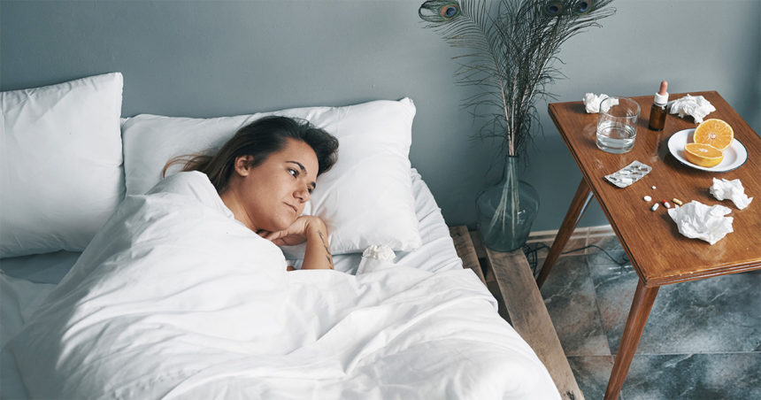 Woman sick in a bed